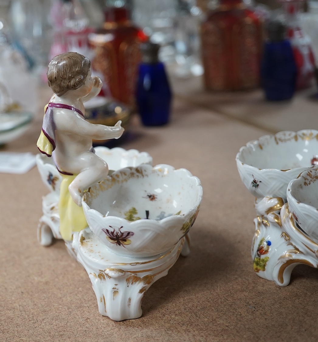 A pair of Berlin figural porcelain salts, hand painted with birds, 13.5cm wide. Condition - fair to good